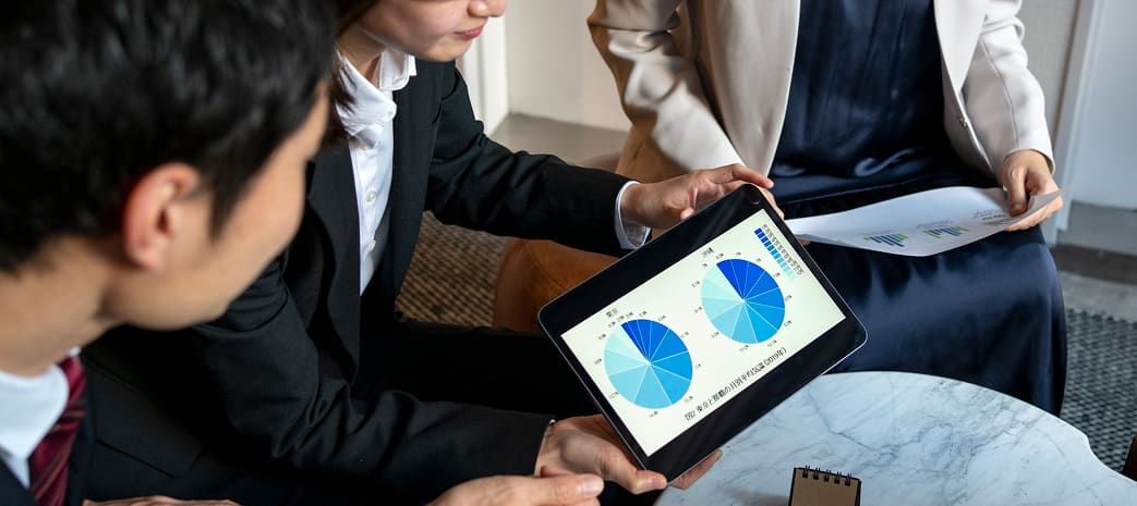 Researcher analyzing industry reports