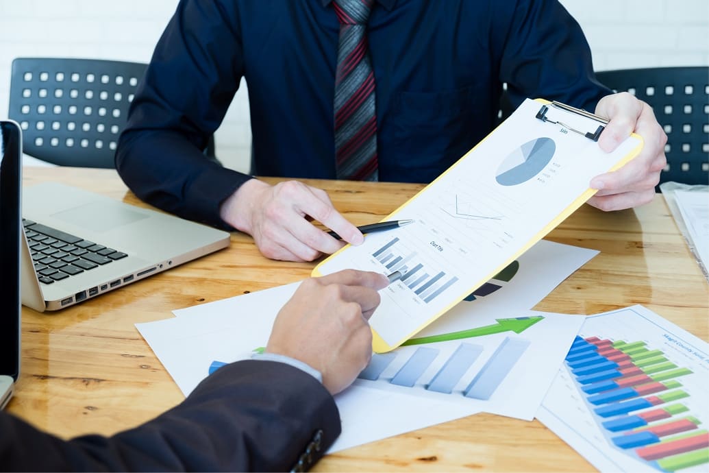 Investors reviewing a sustainable finance strategy
